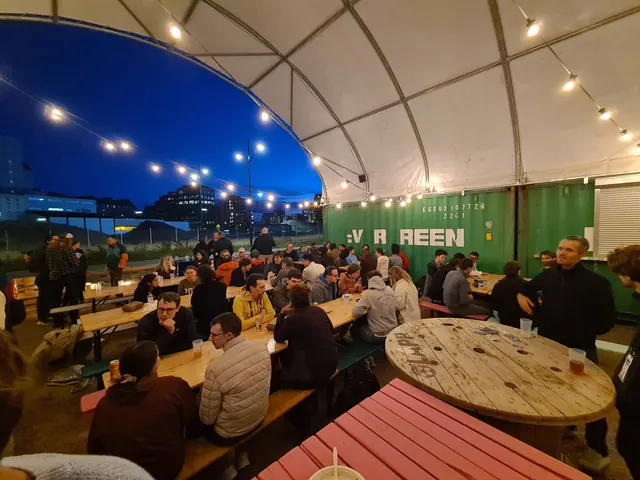 Evening social under a tent with string lights