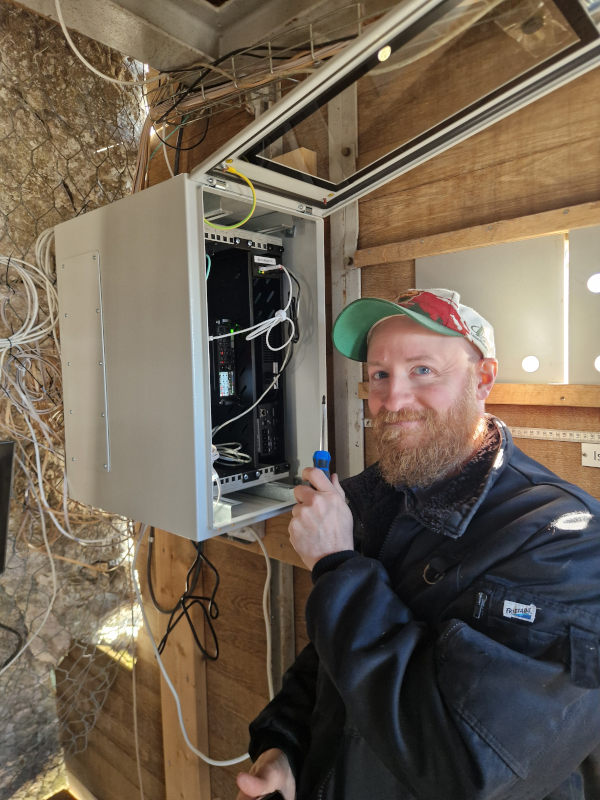 PA working on the installation of recorders in the Auklab.